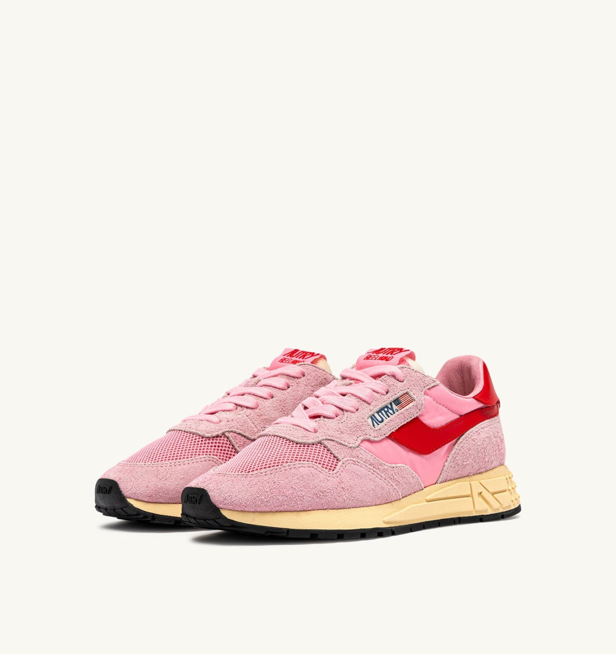 AUTRY REELWIND LOW SNEAKERS IN PINK CHERUB AND FLAME SCARLET NYLON AND SUEDE