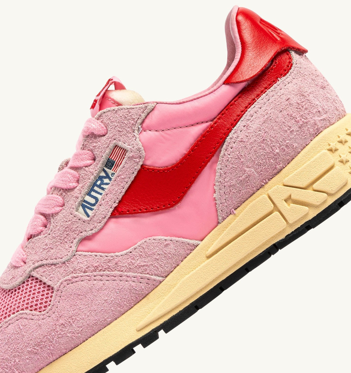 AUTRY REELWIND LOW SNEAKERS IN PINK CHERUB AND FLAME SCARLET NYLON AND SUEDE
