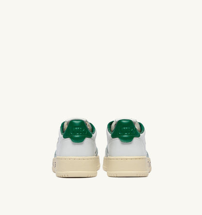 AUTRY MEDALIST LOW SNEAKERS IN LEATHER COLOR WHITE AND GREEN JACKET WITH LETTERING