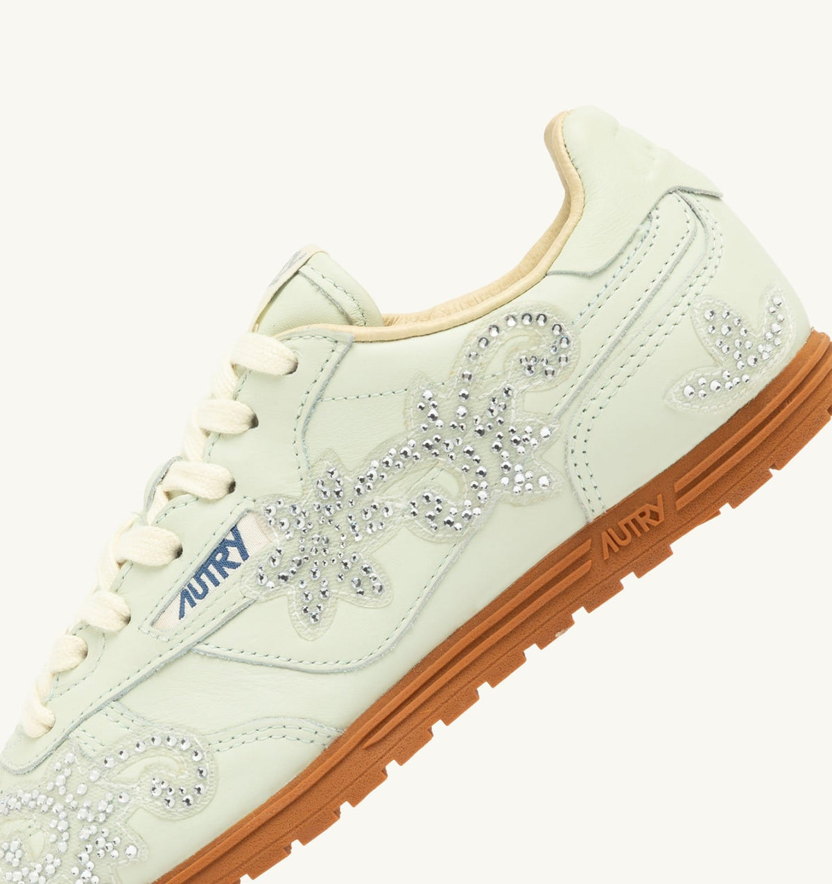 AUTRY WINDSPIN SNEAKERS IN BONE WHITE LEATHER WITH DECORATIONS