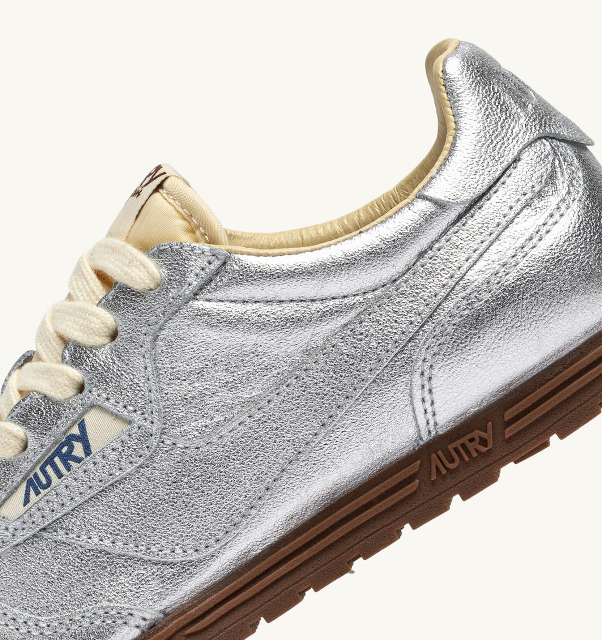 AUTRY WINDSPIN SNEAKERS IN SILVER TONE LAMINATED LEATHER