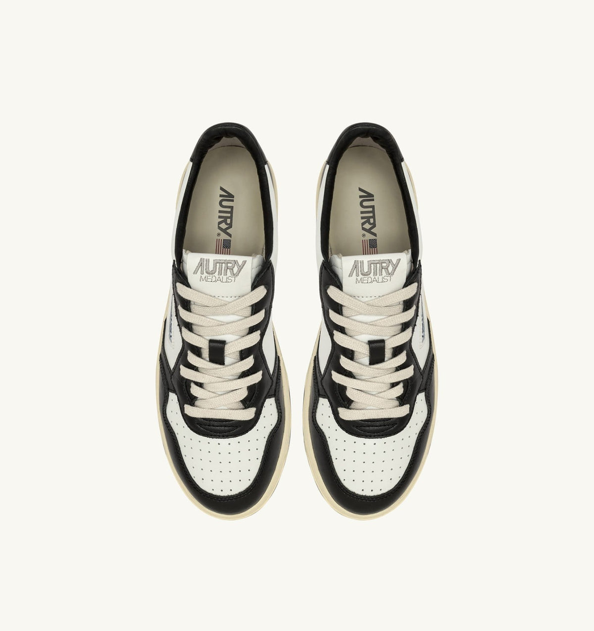 AUTRY MEDALIST LOW SNEAKERS IN WHITE AND BLACK LEATHER WITH LETTERING