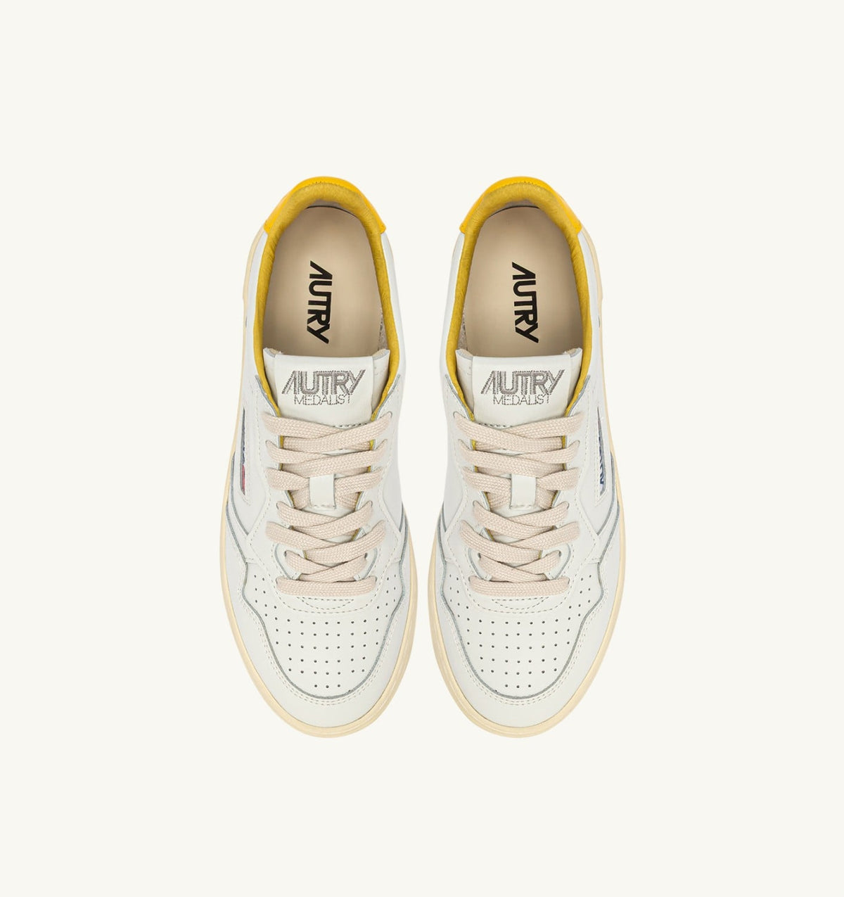 AUTRY MEDALIST LOW SNEAKERS IN WHITE AND SLICKER LEATHER WITH LETTERING
