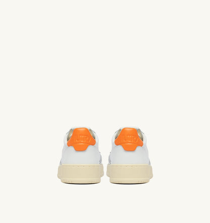AUTRY MEDALIST LOW SNEAKERS IN WHITE AND PARSIMMON ORANGE LEATHER