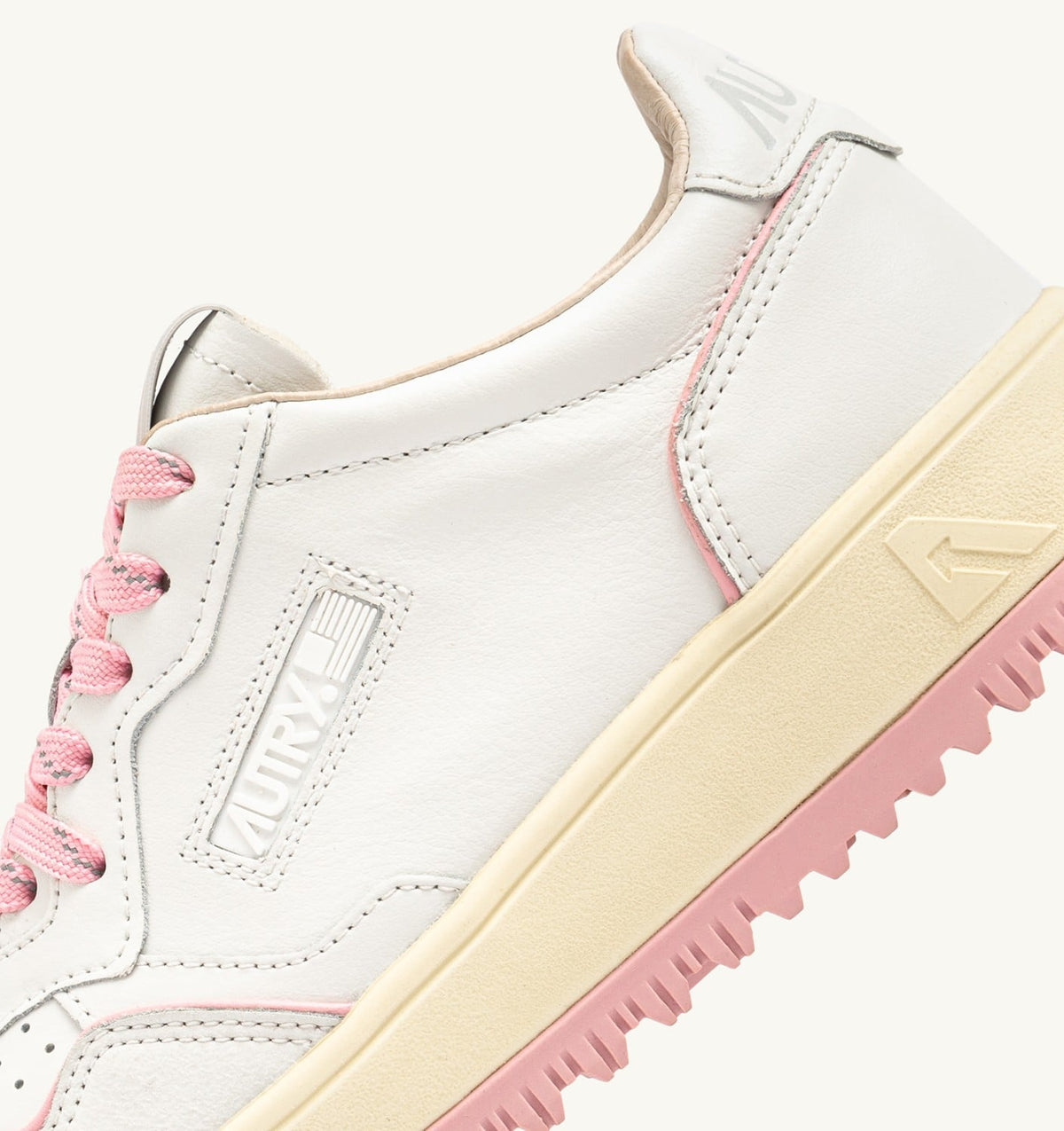 AUTRY GOLF LOW SNEAKERS IN WHITE AND CORAL BLUSH LEATHER