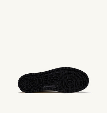 AUTRY GOLF LOW SNEAKERS IN WHITE AND BLACK LEATHER