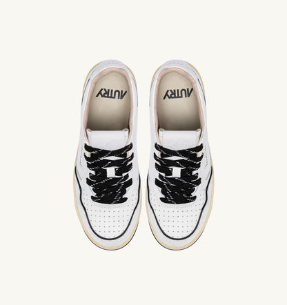AUTRY GOLF LOW SNEAKERS IN WHITE AND BLACK LEATHER