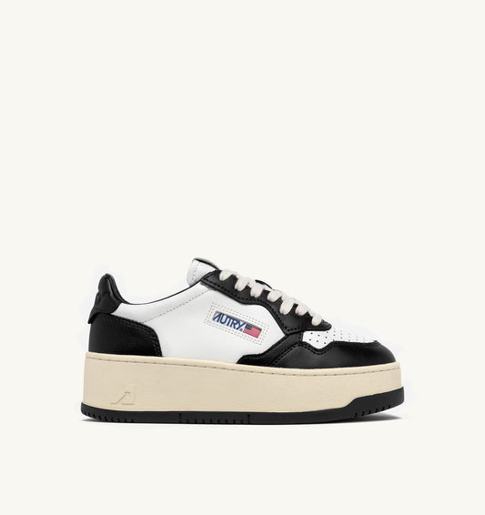 AUTRY MEDALIST PLATFORM SNEAKERS IN WHITE AND BLACK LEATHER