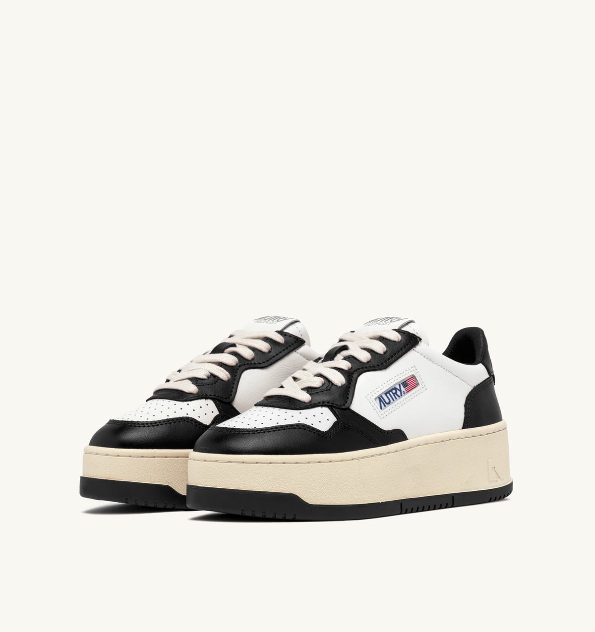 AUTRY MEDALIST PLATFORM SNEAKERS IN WHITE AND BLACK LEATHER