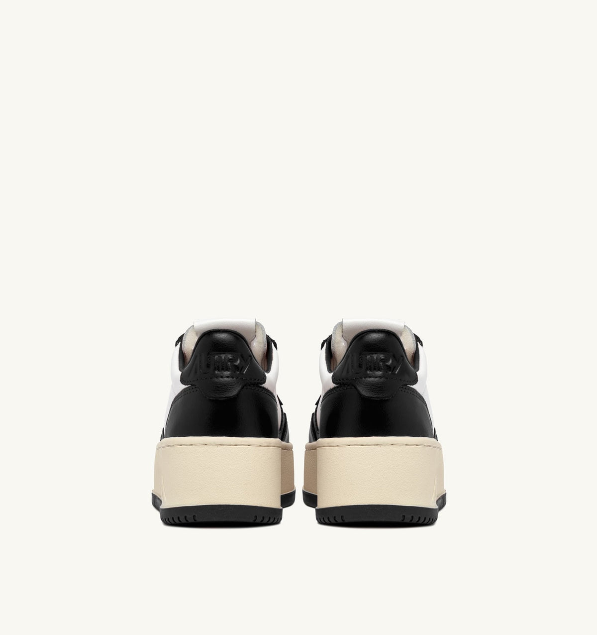 AUTRY MEDALIST PLATFORM SNEAKERS IN WHITE AND BLACK LEATHER