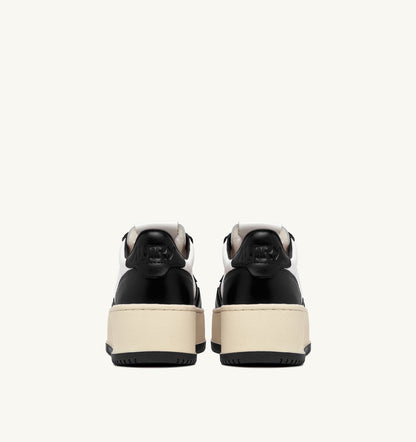 AUTRY MEDALIST PLATFORM SNEAKERS IN WHITE AND BLACK LEATHER