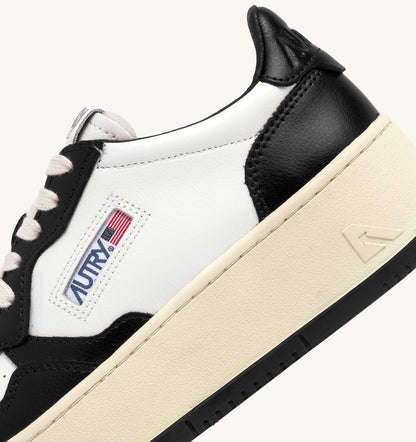 AUTRY MEDALIST PLATFORM SNEAKERS IN WHITE AND BLACK LEATHER