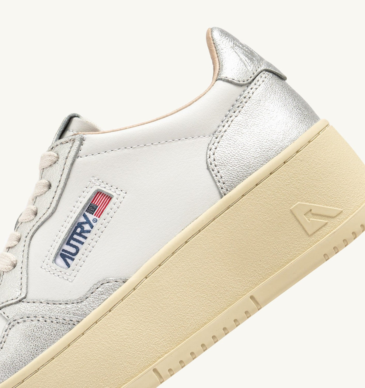 AUTRY MEDALIST PLATFORM SNEAKERS IN WHITE AND METALIZED SILVER LEATHER