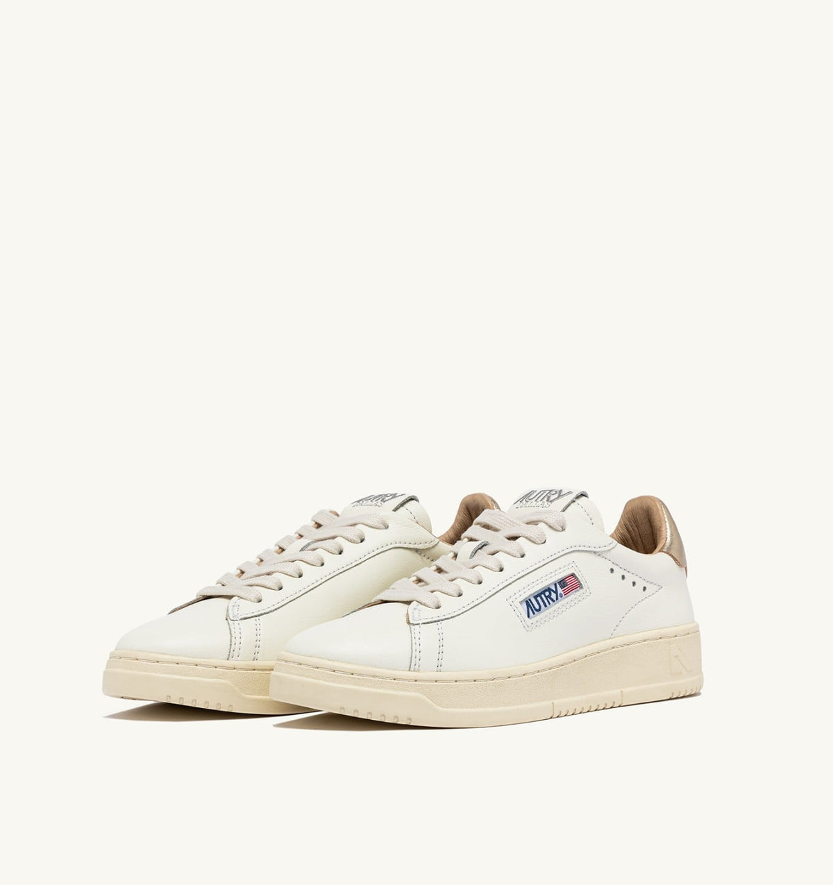 AUTRY DALLAS LOW SNEAKERS IN WHITE AND GOLD LEATHER