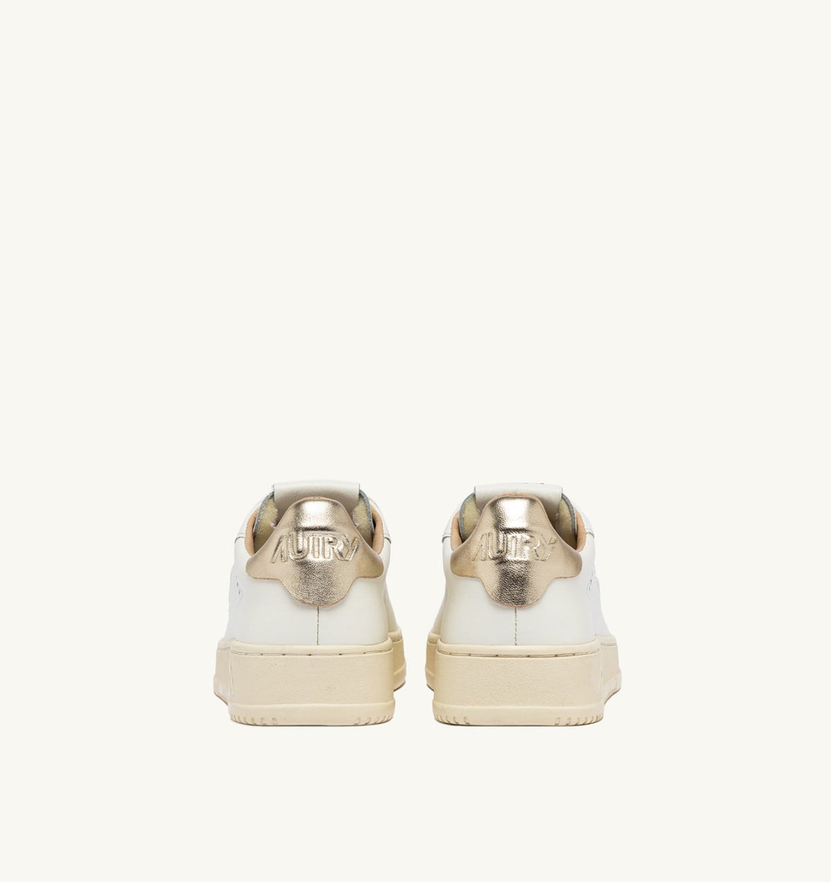 AUTRY DALLAS LOW SNEAKERS IN WHITE AND GOLD LEATHER