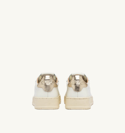 AUTRY DALLAS LOW SNEAKERS IN WHITE AND GOLD LEATHER